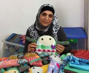 Women make “Jaffa Dolls” at the Arous El Bahar women’s center, a place to socialize and learn.